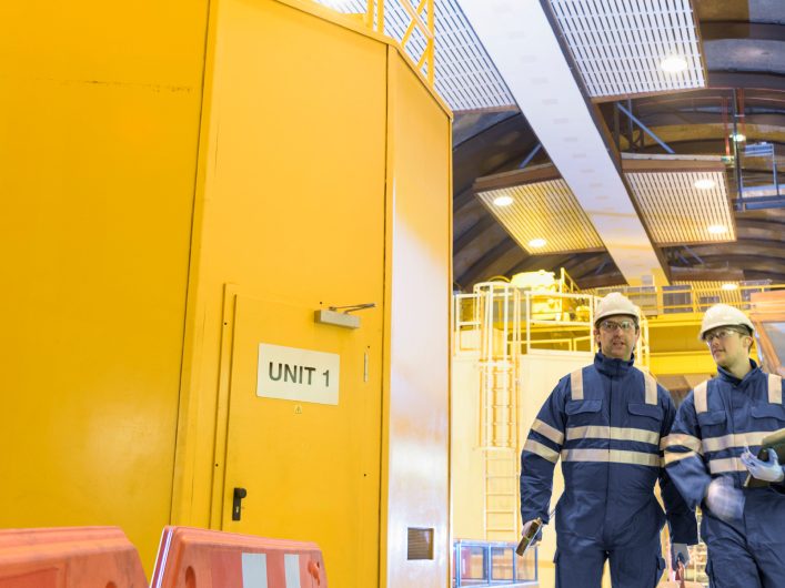 Engineers inspecting equipment in an industrial plant